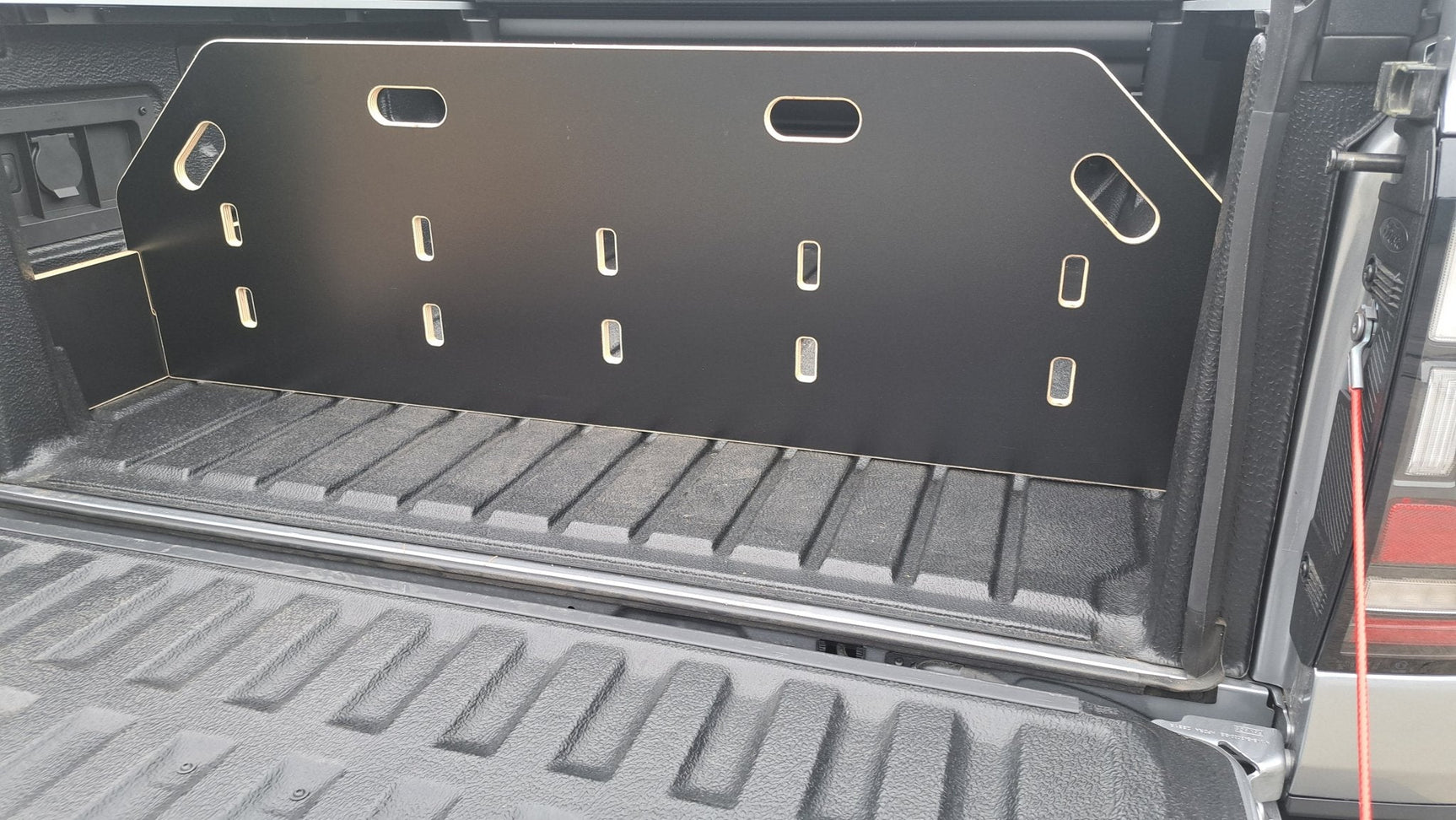 Next Gen Ranger bed divider securing equipment in the ute’s tray, perfect for organised storage.